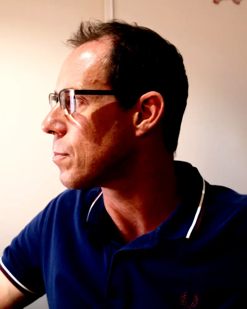 Glenn Hammond at his desk, in profile.